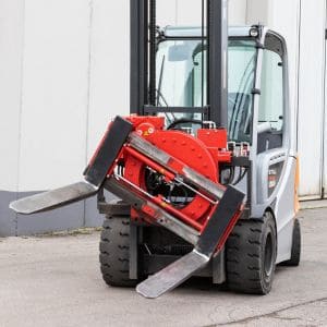 ATIB Italian-built 360-degree forklift rotator attachment with integral sideshift mounted on forklift in recycling yard