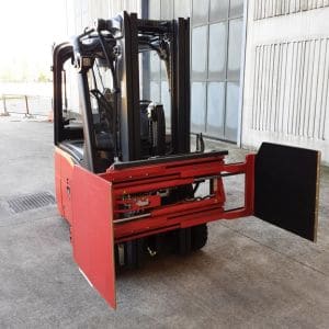 ATIB Italian-built forklift side clamp attachment gripping scrap metal bale in recycling yard